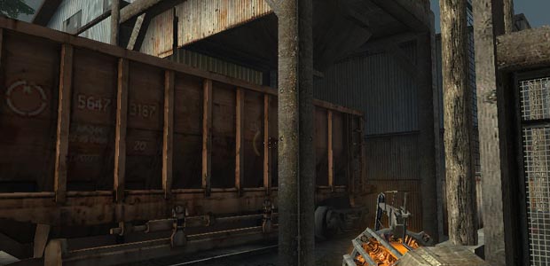The opening that will fill the hoppers can only reach one half of the car, and there is a wall right behind the car, preventing it from moving any further.